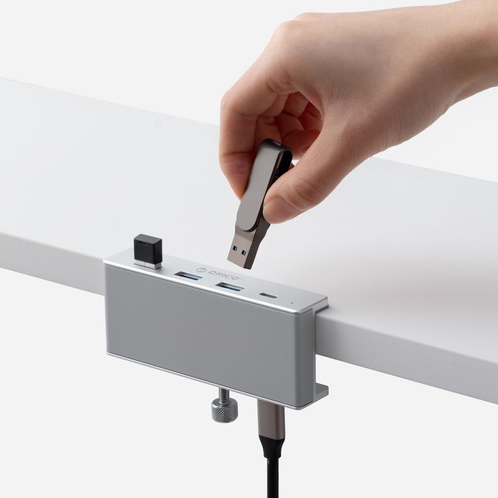 Produktbild Orico Converter MH4PC Hub Clamp-Mounted USB-C / 3x USB-A 3.0 + 1x USB-C 3.0 - Silver (USB-C, 4 Ports)