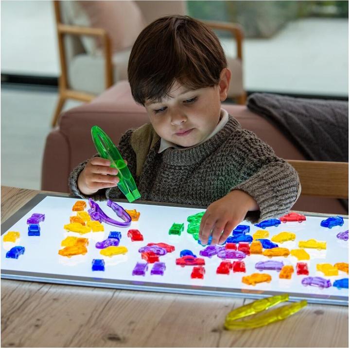 Actual product image TickiT Set with 72 colorful, translucent plastic car figures in a storage box