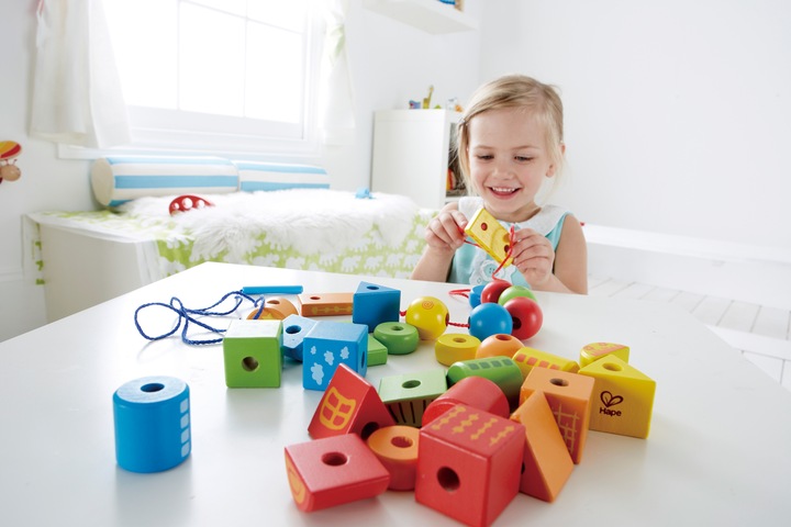 Actual product image Hape Threading blocks