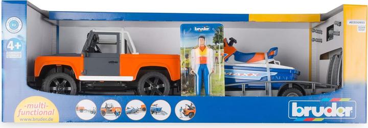 Immagine prodotto Bruder Veicolo Land Rover Defender Pick Up con rimorchio, moto d'acqua e autista