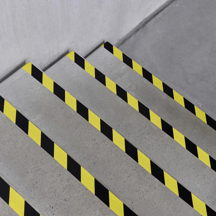 Actual product image Defender EXA-TAPE® BY 50 BULK - Premium fabric adhesive tape BULK | black/yellow | glossy | 50 mm x 50 m (50 mm)