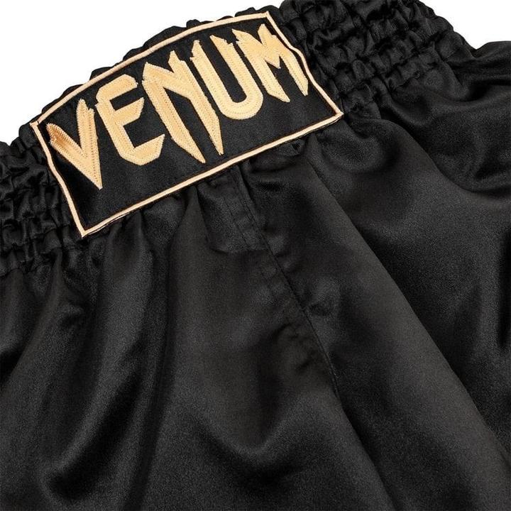 Immagine prodotto Venum Pantaloncini classici di Muay Thai nero/oro (XXL)