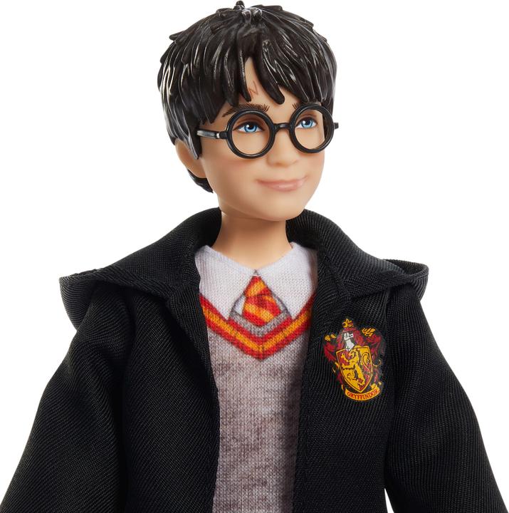Actual product image 0 -Fashion doll in typical Hogwarts garb with wand accessory, inspired by the film.