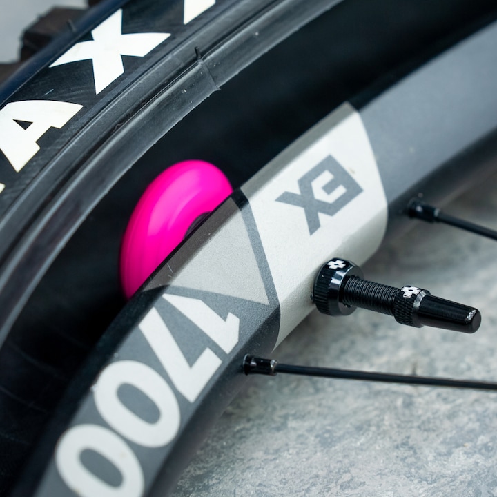 Actual product image Muc-Off Tubeless Secure Tag Holder pink/black