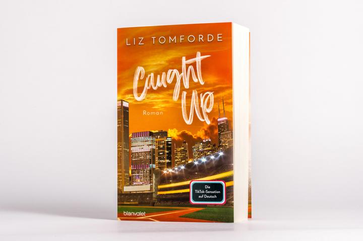 Actual product image Caught up (German, Liz Tomforde, 2024)