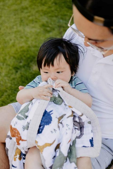 Actual product image little unicorn Cotton Muslin Baby Blanket - Dino Friends (120 x 120 cm)