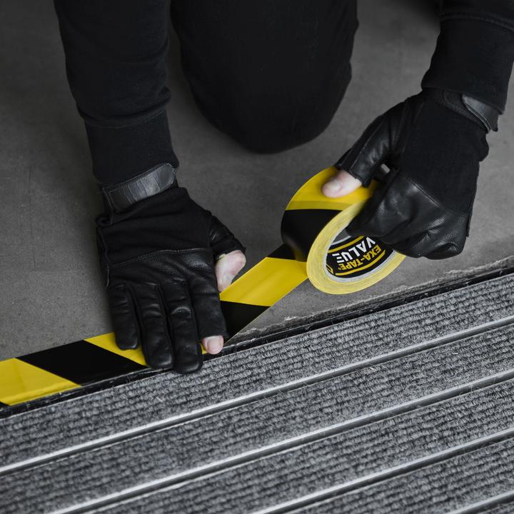 Produktbild Defender EXA-TAPE® VALUE BY 50 - PVC Warnband | schwarz/gelb | 50 mm x 33 m (50 mm)