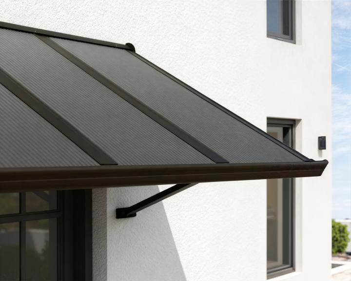 Actual product image Palram Canopia | Augustine 4.8ft Door Awning Black Structure / Opaque Grey Panels