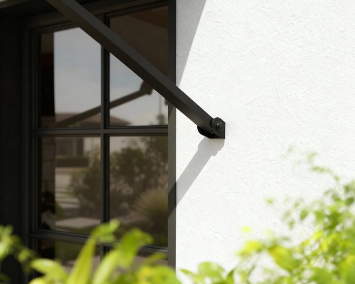 Actual product image Palram Canopia | Augustine 4.8ft Door Awning Black Structure / Opaque Grey Panels