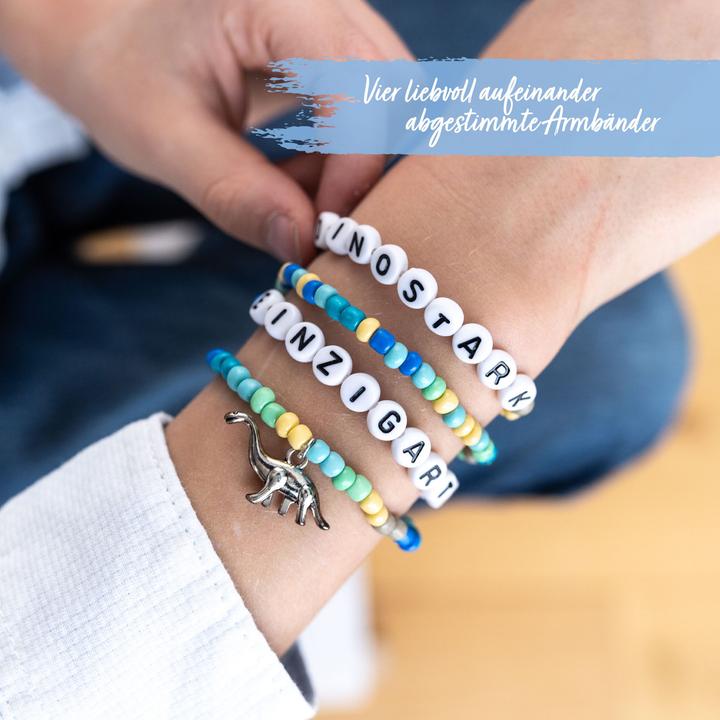 Produktbild Papierdrachen 4 Perlenarmbänder – DINOSTARK und EINZIGARTIG (Kunststoff, Metall, Gummi)