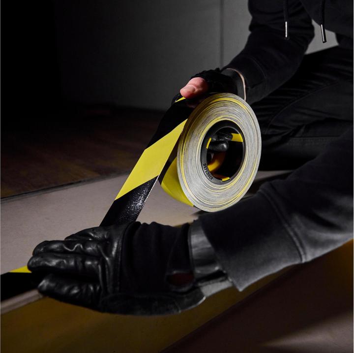 Actual product image Defender EXA-TAPE® BY 50 BULK - Premium fabric adhesive tape BULK | black/yellow | glossy | 50 mm x 50 m (50 mm)