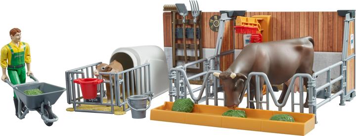 Bruder Kuh und Kälberstall mit Landwirt