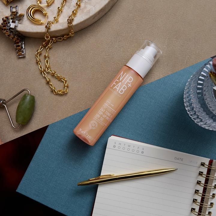 Productafbeelding Nip + Fab Nipfab Peptide Fix 2-in-1 Tone & Top-Up Mist SPF 50 (Zonnebrandspray, SPF 50, 75 ml)