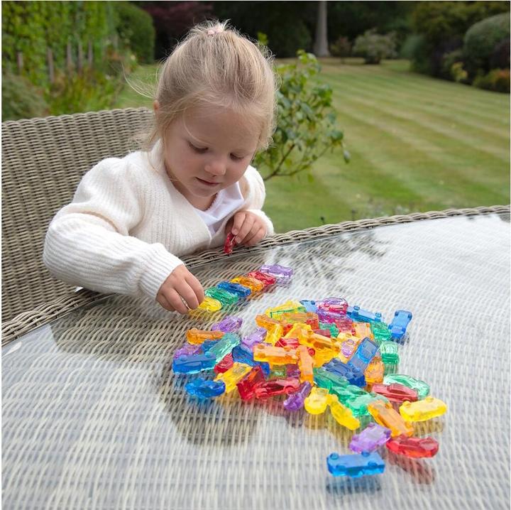Actual product image TickiT Set with 72 colorful, translucent plastic car figures in a storage box