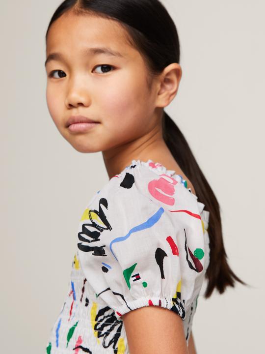 Actual product image Tommy Hilfiger ALLOVER PRINT SMOCKED DRESS Meisjes Jurk - White - Maat 12 (152)
