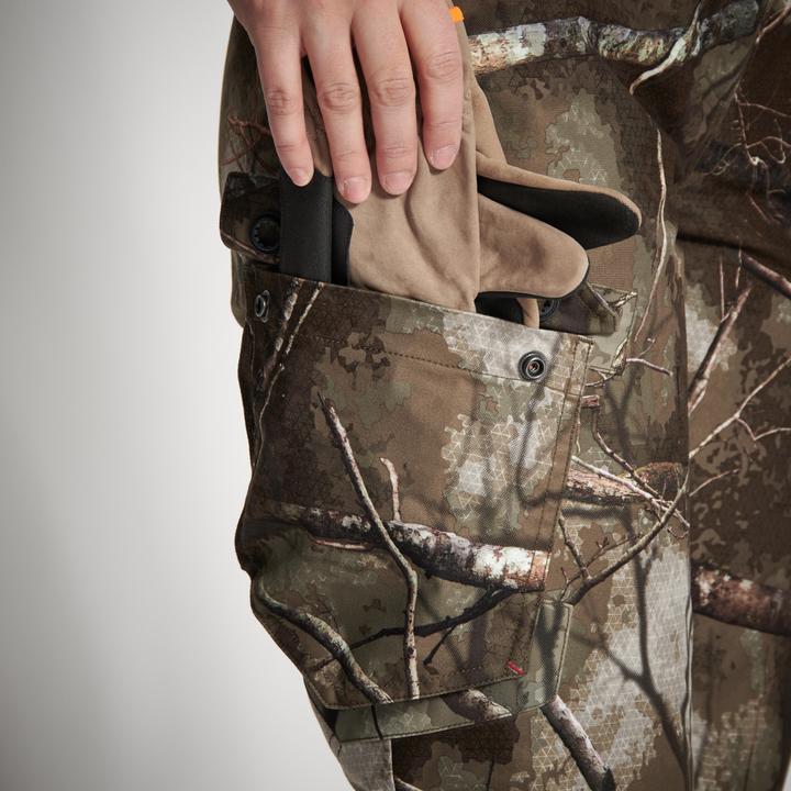 Immagine prodotto Solognac Pantaloni da pioggia da caccia Treemetic 500 da donna caldi impermeabili a basso rumore mimetici (46)
