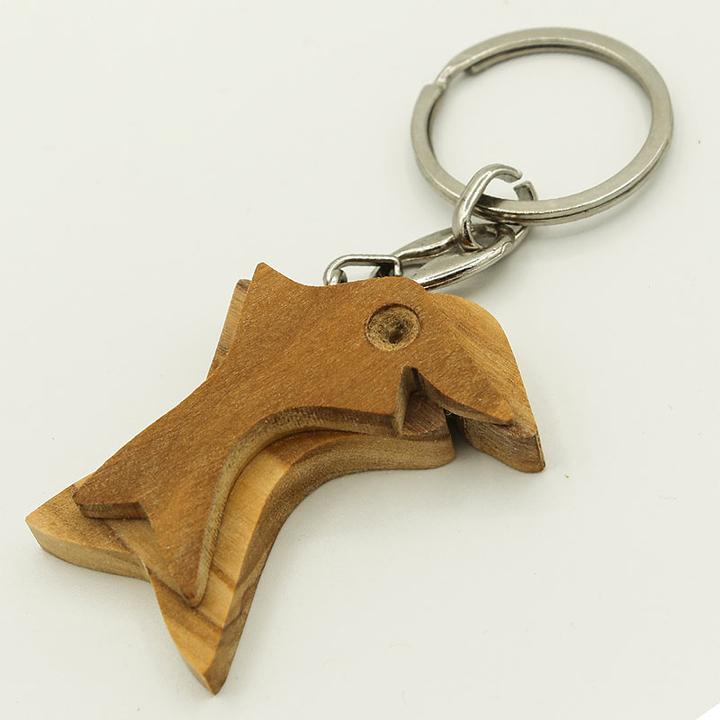 Actual product image Natura Punto Keychain dolphin, olive wood, brown, 5 x 5cm