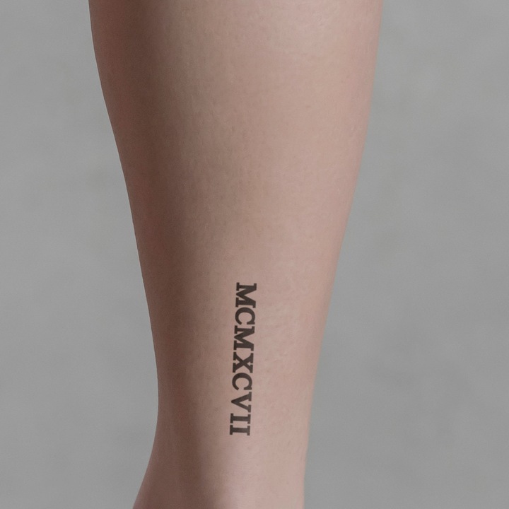 Actual product image minink Temporary tattoo - Roman numeral MCMXCVII (1997)