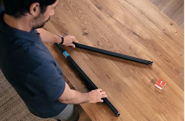 Produktbild tesa FALT Insektenschutz für Fenster, grössenverstellbarer Alu-Rahmen, faltbar (140 x 140 cm)