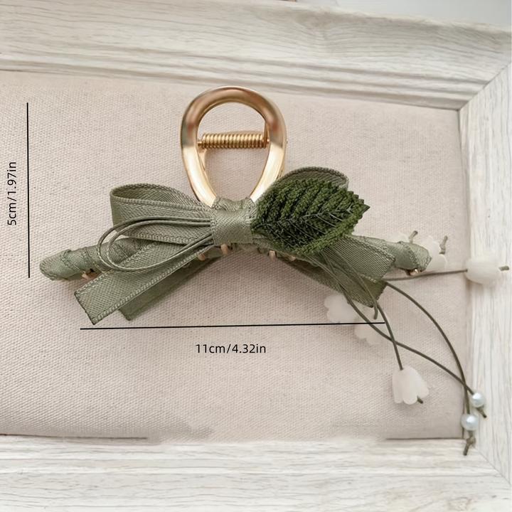 Produktbild Activity Board 1 Stück Elegante französische Maiglöckchen-Haarspange mit Quaste ist eine schicke Spange (1 Stk.)