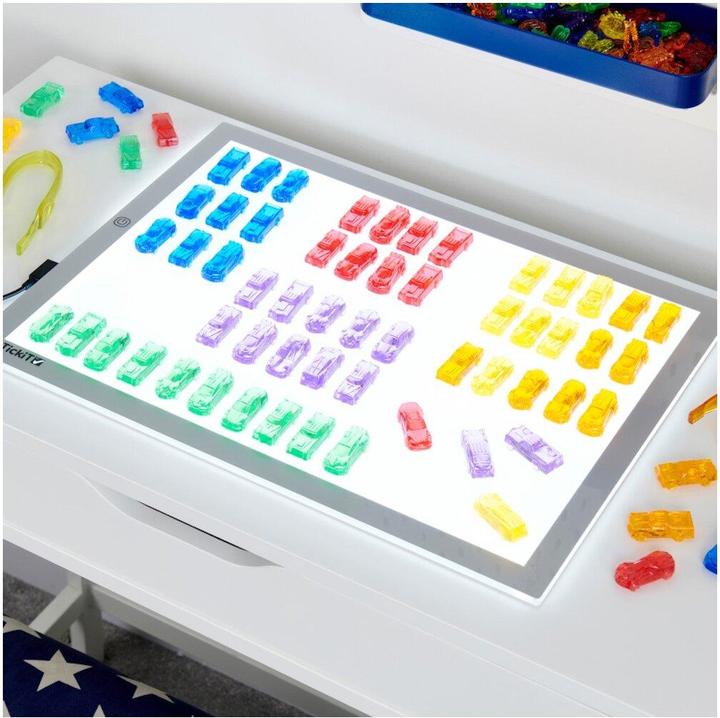Actual product image TickiT Set with 72 colorful, translucent plastic car figures in a storage box