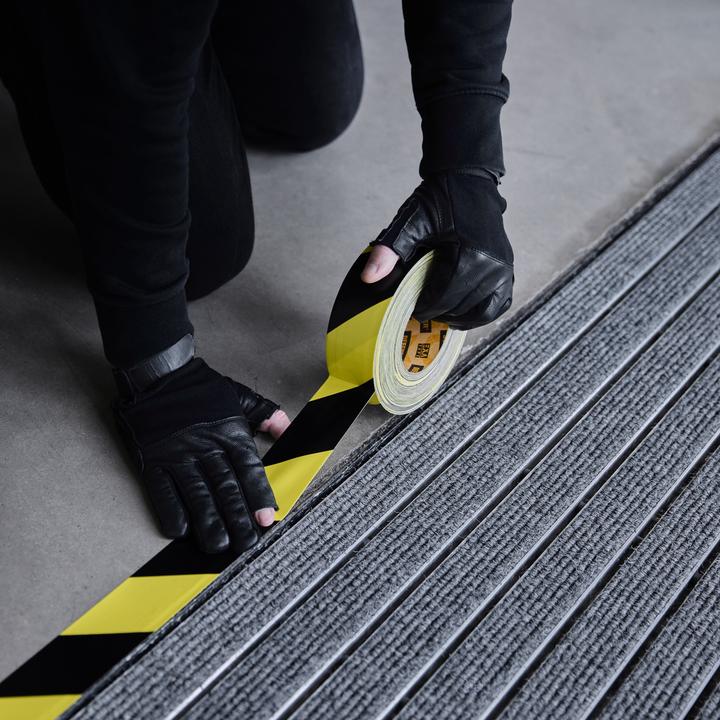 Actual product image Defender EXA-TAPE® BY 50 BULK - Premium fabric adhesive tape BULK | black/yellow | glossy | 50 mm x 50 m (50 mm)