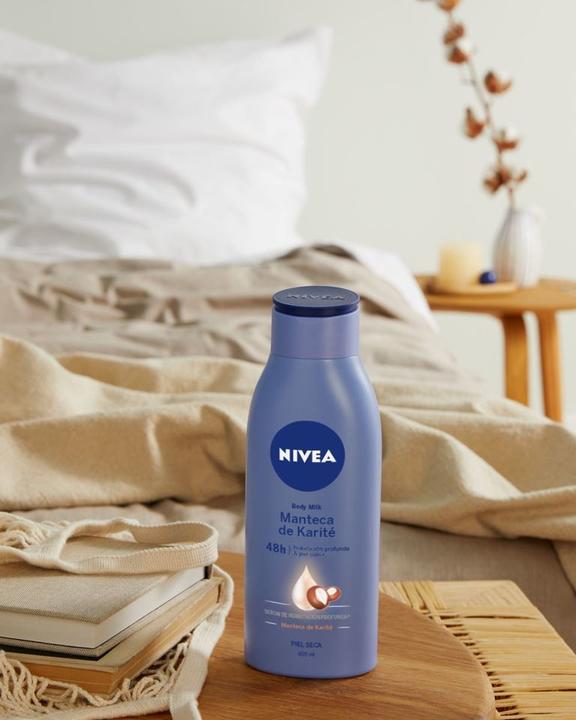 Immagine prodotto NIVEA Latte corpo liscio TRIPLE ACCION 400 ml (Crema corpo, 400 ml)
