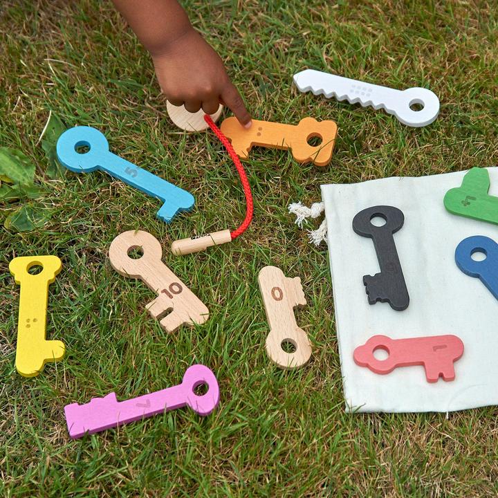 Actual product image TickiT Rainbow wooden keys – 11 numbered keys with threading cord & bag