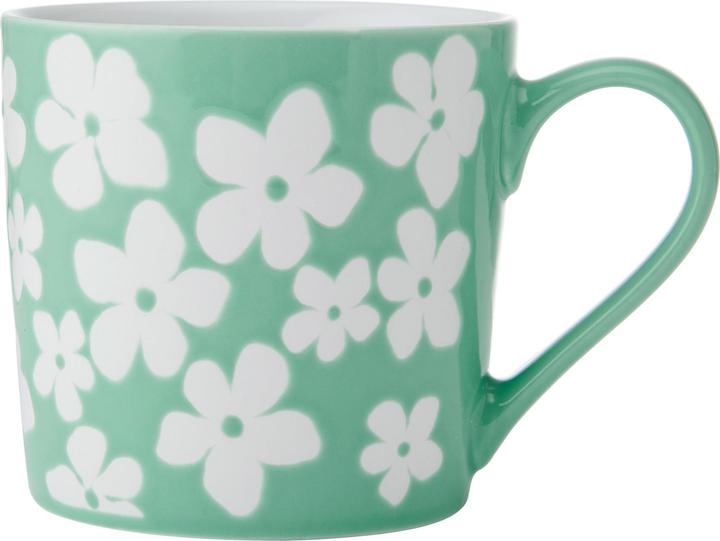 green glaze with a white floral pattern, green wax resist glaze and a white floral pattern