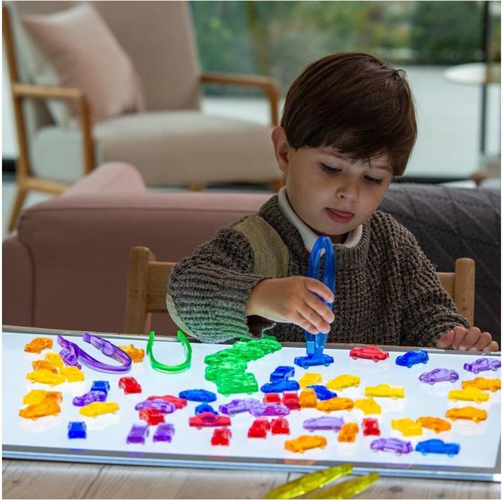 Actual product image TickiT Set with 72 colorful, translucent plastic car figures in a storage box