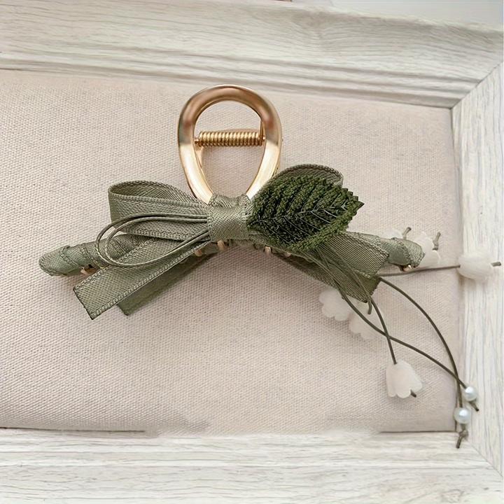 Produktbild Activity Board 1 Stück Elegante französische Maiglöckchen-Haarspange mit Quaste ist eine schicke Spange (1 Stk.)