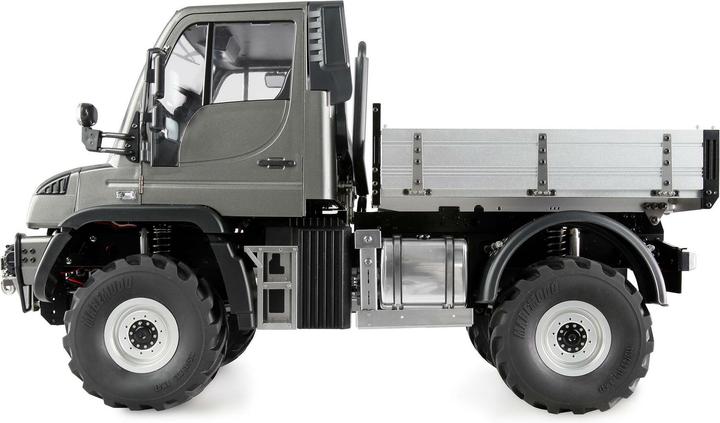Immagine prodotto Amewi Mercedes-Benz Unimog, trasportatore di attrezzi 4WD (ARR Quasi lettura a corredo)