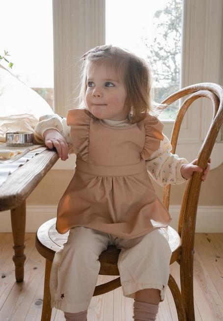 Actual product image Elodie Apron bib Blushing (36 Months)
