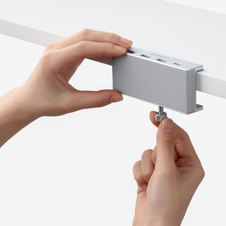 Produktbild Orico Converter MH4PC Hub Clamp-Mounted USB-C / 3x USB-A 3.0 + 1x USB-C 3.0 - Silver (USB-C, 4 Ports)