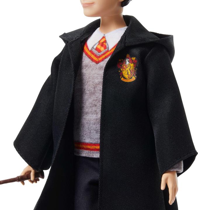 Actual product image 0 -Fashion doll in typical Hogwarts garb with wand accessory, inspired by the film.