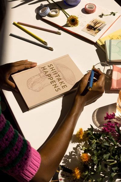 Actual product image Designworks Vintage Sass Notebook with Pen - Shiitake Happens (Lined, Hardcover)