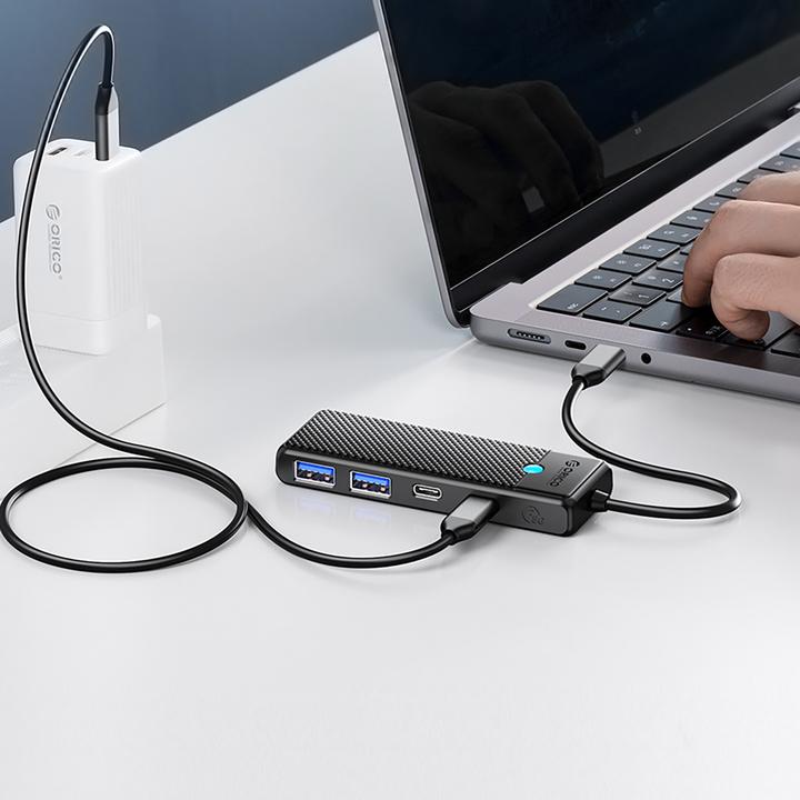Actual product image Orico Converter Hub USB-C PAPW2AC-C3 docking station 2x USB-A 3.0 + 2x USB-C 3.0 - black (USB-C, 4 ports)