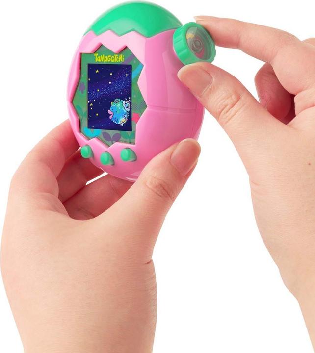 Produktbild Bandai Tamagotchi Paradise Land pink (Deutsch, Spanisch, Chinesisch, Französisch, Koreanisch, Japanisch, Italienisch, Portugiesisch, Englisch)