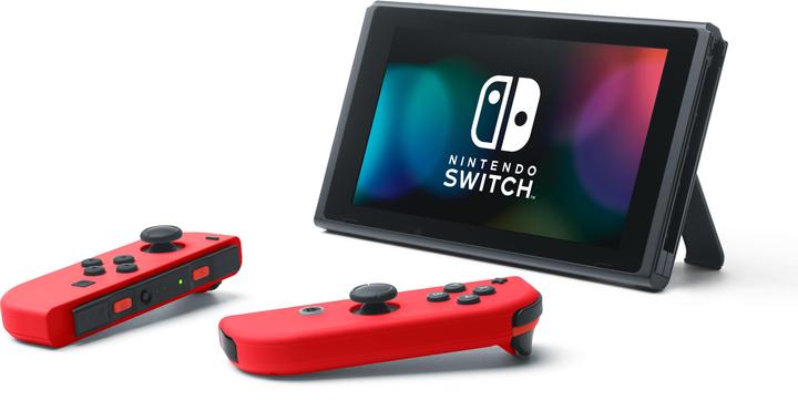 Image du produit Nintendo Switch Rouge + Code de téléchargement Super Mario Odyssey + Autocollant du film Super Mario Bros.