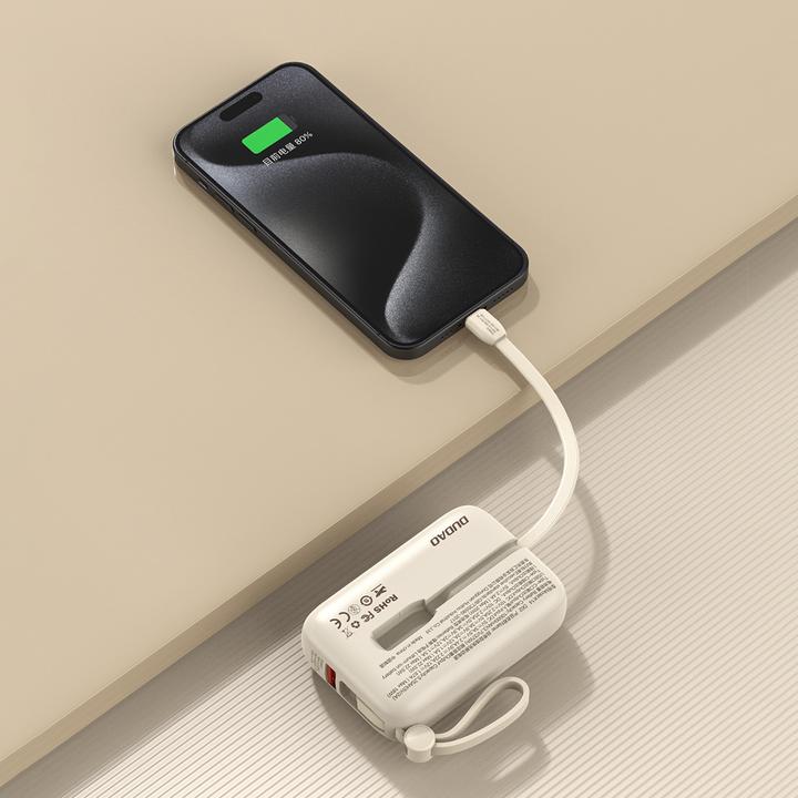 Actual product image Dudao K14 10000mAh power bank with USB-C / Lightning cables - beige (10000 mAh, 22.50 W, 37 Wh)