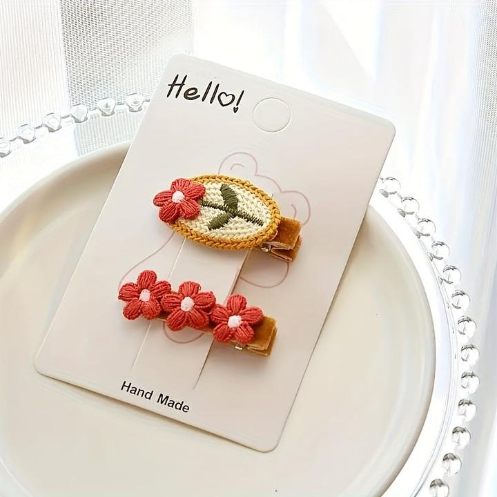 Immagine prodotto Activity Board Gestrickte rote Blume Haarspange