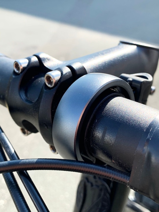 Actual product image knog. Oi Classic Bike Bell - Black/Grey - Large, 23.8 - 31.8mm
