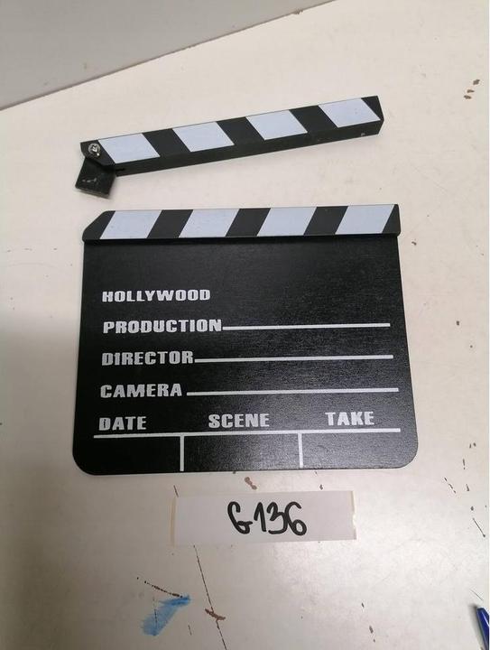 Produktbild Amscan Filmklappe Hollywood 17.8x25.3cm (1 Stück)