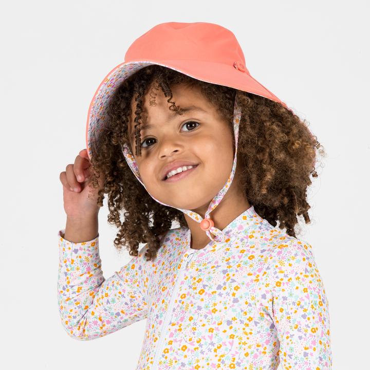 Image du produit Nabaiji Chapeau anti UV réversible Bébé - corail et imprimés fleurs (98, 104, 110)