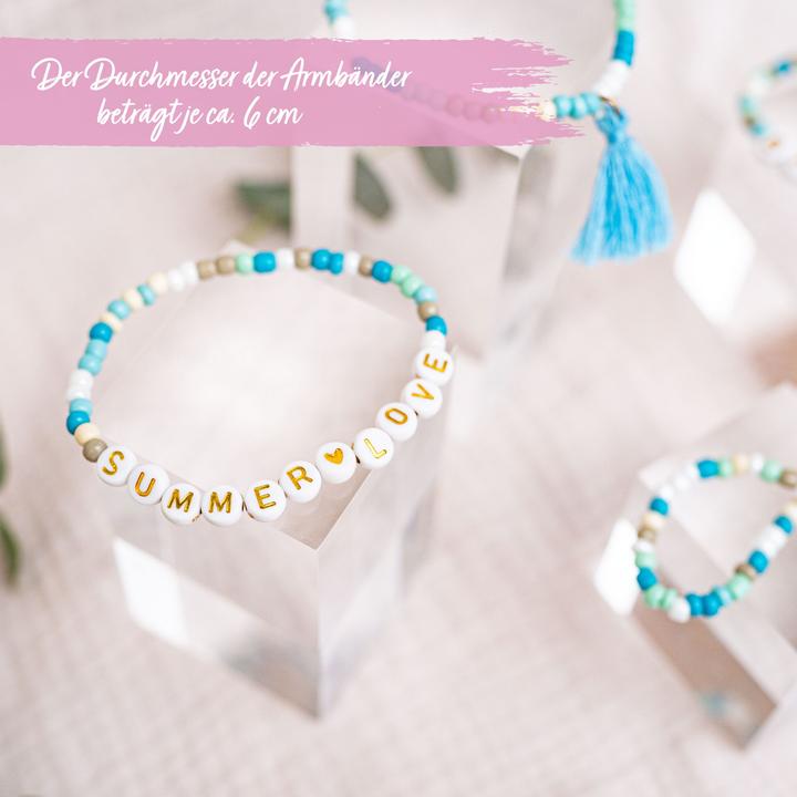 Actual product image Papierdrachen 4 Perlenarmbänder – BEACHVIBES und SUMMERLOVE (Plastic, Fabric, Rubber)