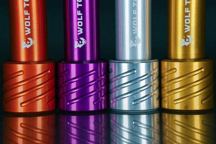 Actual product image Wolf Tooth Fox Thru Axle, Front 15x110mm, M14x1.5mm, Floating Axle, orange