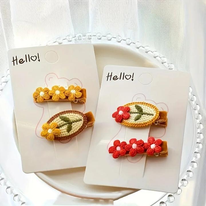 Image du produit Activity Board Gestrickte rote Blume Haarspange