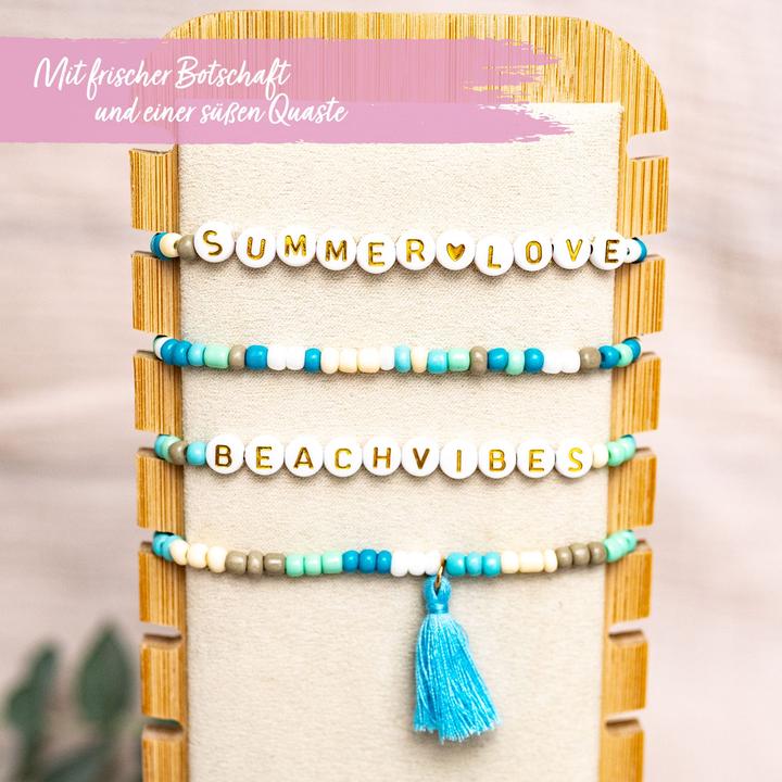 Actual product image Papierdrachen 4 Perlenarmbänder – BEACHVIBES und SUMMERLOVE (Plastic, Fabric, Rubber)